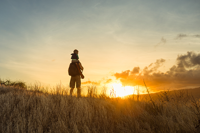 parent and child watching the sunrise