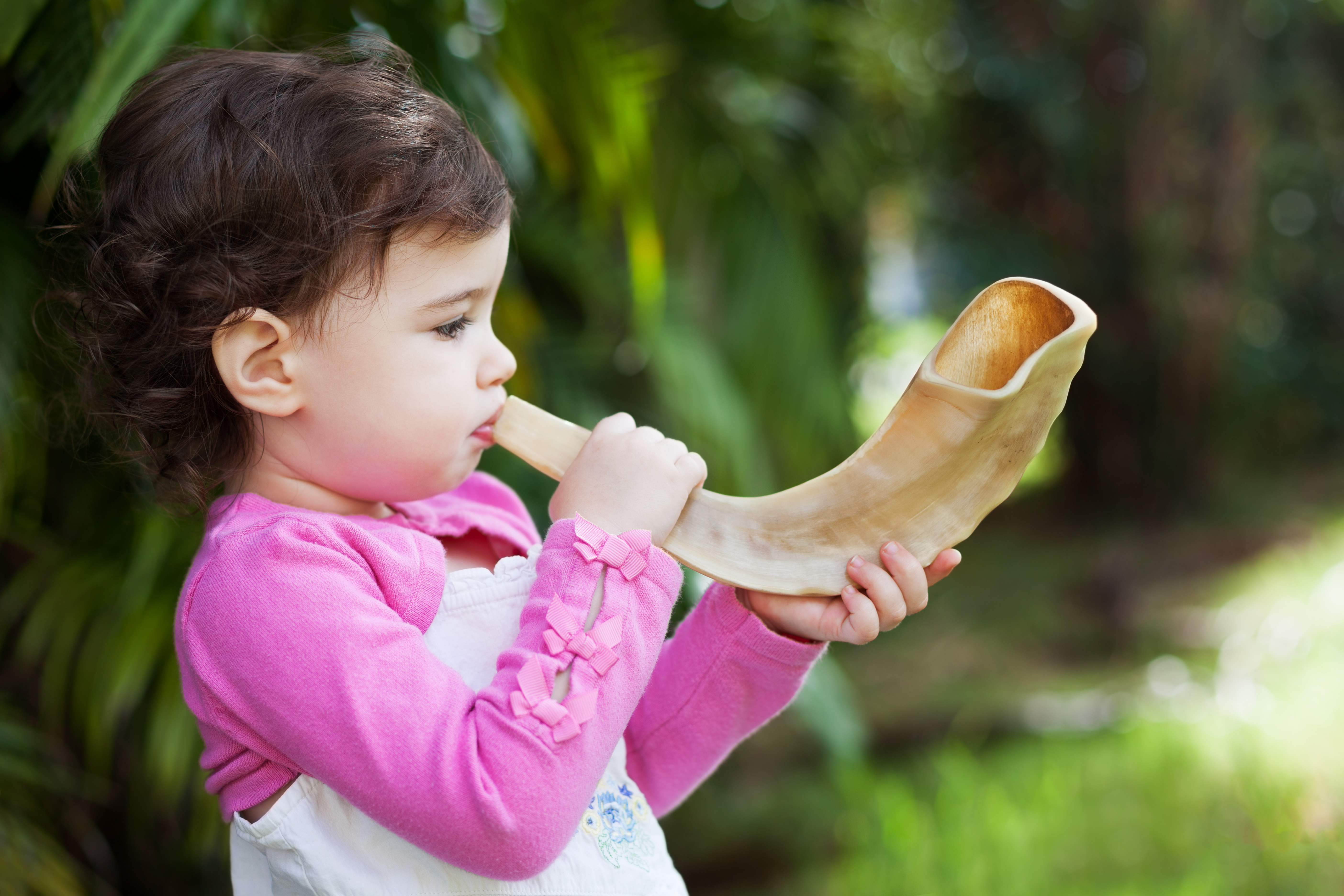 A child blowing a shofar