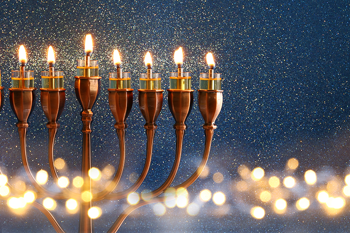 Photo of a menorah with 7 candles lite