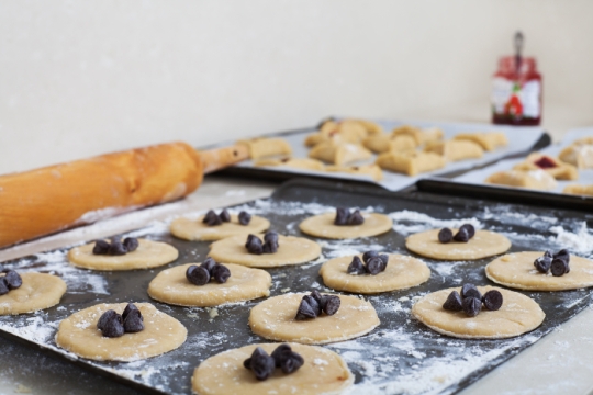 Unbaked hamantaschen on a baking sheet