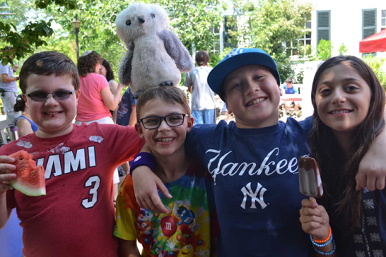 Photo of four kids at camp